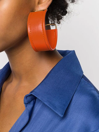 Shop Jacquemus Bangle-style Hoop Earrings In Orange