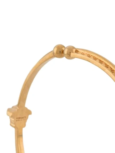 Shop Versace Greca Hoop Ear Cuffs In Gold