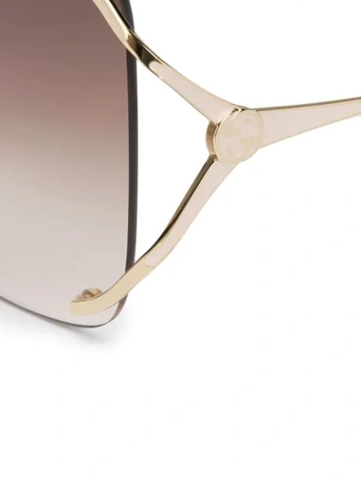 Shop Gucci Navigator Frame Sunglasses In Gold