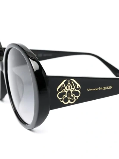 Shop Alexander Mcqueen Seal Oval Frame Sunglasses In Black
