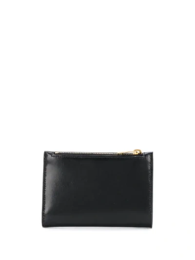 Shop Saint Laurent Bi-fold Embossed Logo Wallet In Black