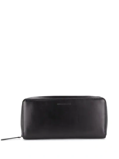 Shop Ann Demeulemeester Embossed Logo Zip-around Wallet In Black