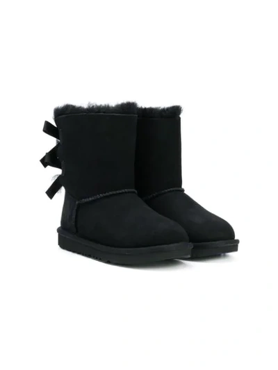 Shop Ugg Shearling Bow Boots In Black