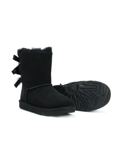 Shop Ugg Shearling Bow Boots In Black
