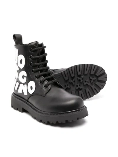 Shop Moschino Graphic Motif Lace-up Boots In Black