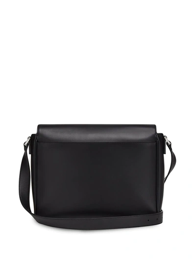 Shop Fendi Debossed Logo Messenger Bag In Black