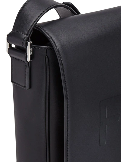 Shop Fendi Debossed Logo Messenger Bag In Black