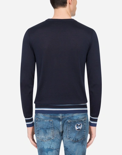 Shop Dolce & Gabbana Round-neck Silk Sweater With Intarsia And Dg Logo In Blue