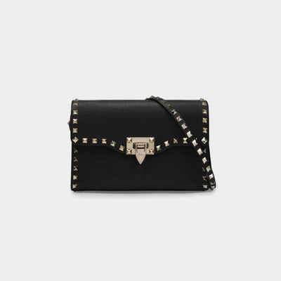 Shop Valentino Rockstud Crossbody Bag In Black