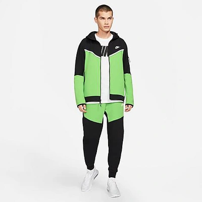Shop Nike Tech Fleece Taped Jogger Pants In Black/mean Green/white