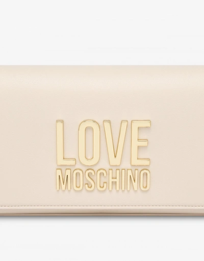 Shop Love Moschino Gold Metal Logo Clutch In Black
