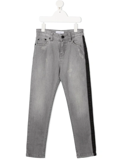 Shop Givenchy Side Stripe Distressed Jeans In Grey