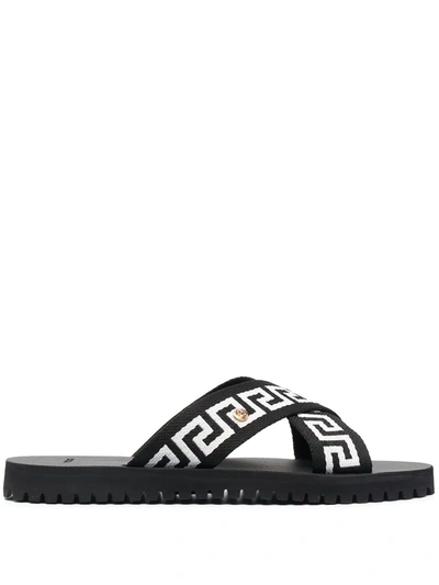 Shop Versace Greca-motif Crossover-strap Sandals In Black