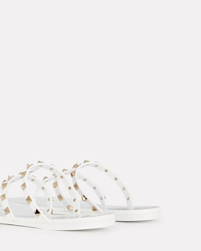 Shop Valentino Rockstud Jelly Thong Sandals In Ivory