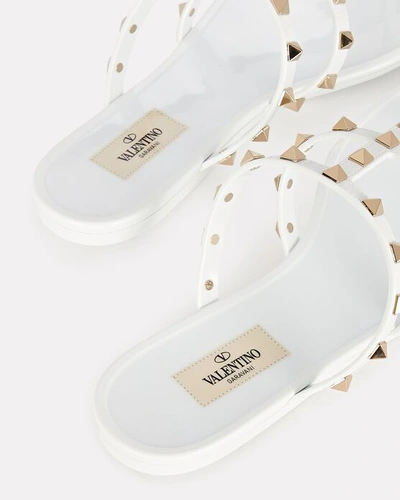 Shop Valentino Rockstud Jelly Thong Sandals In Ivory
