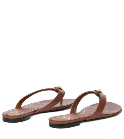 Shop Valentino Roman Stud Leather Thong Sandals In Brown