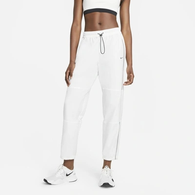 Shop Nike Pro Women's Woven Pants In White,metallic Silver