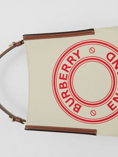 Shop Burberry Small Logo Graphic Canvas Peggy Bucket Bag In Natural/tan/fiery Red
