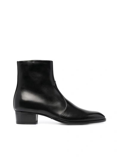 Shop Saint Laurent Wyatt Zipped Boots In Black