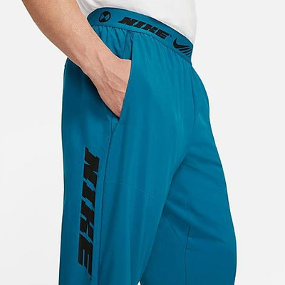 Shop Nike Men's Sport Clash Jogger Pants In Green