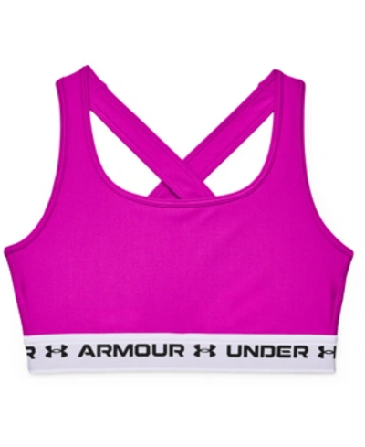 Shop Under Armour Women's Heatgear Medium Impact Sports Bra In Meteor Pink