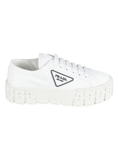 Shop Prada Embossed Logo Sneakers In White