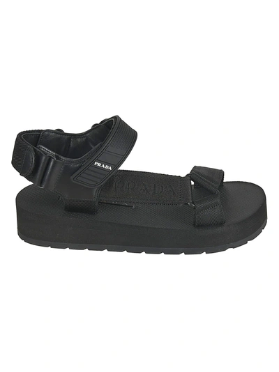 Shop Prada Strappy Logo Sandals In Black