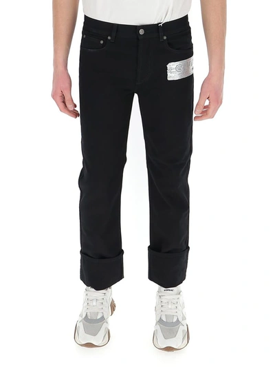 Shop Givenchy Logo Patch Jeans In Black
