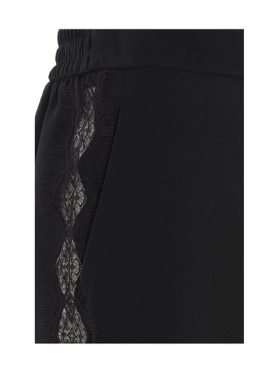 Shop Stella Mccartney Tapered Leg Trousers In Black