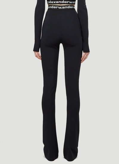 Shop Alexander Wang Flared Logo Pants In Black