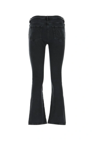 Shop Valentino Quote Embroidered Flared Jeans In Black