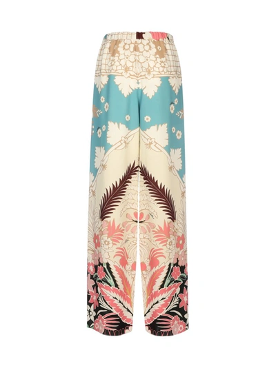 Shop Valentino Printed Drawstring Trousers In Multi