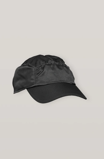 Shop Ganni Satin Ruched Cap In Black