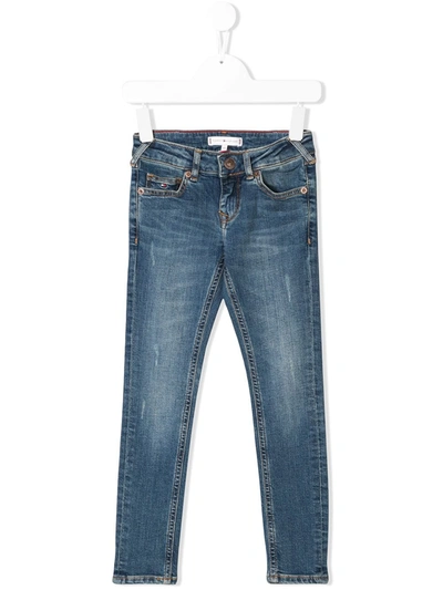 Shop Tommy Hilfiger Junior Faded Skinny Jeans In Blue