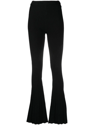 Shop Sandro Flared Noe Trousers In Black