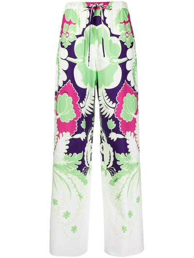 Shop Valentino Arazzo-print Wide-leg Trousers In Green