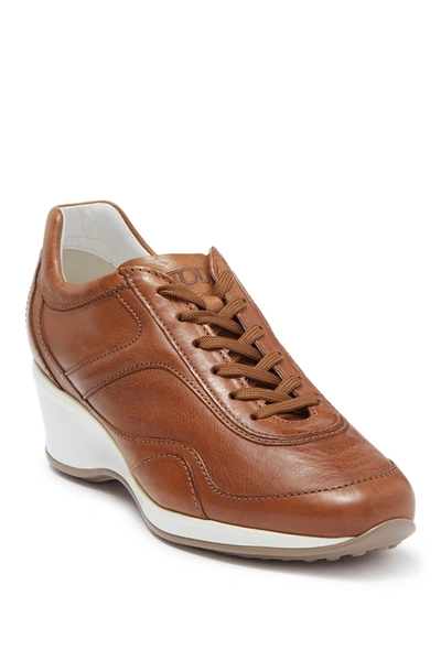 Shop Tod's Leather Wedge Sneaker In Light Camel