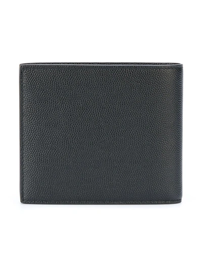 Shop Saint Laurent East West Leather Wallet In Black