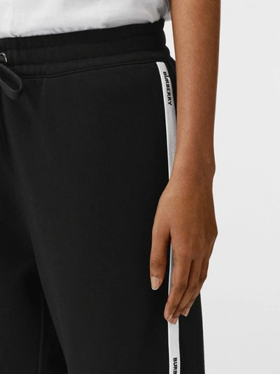 Shop Burberry Logo Tape Cotton Jogging Pants In Black