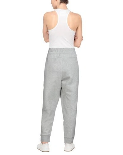 Shop Nike Pants In Light Grey