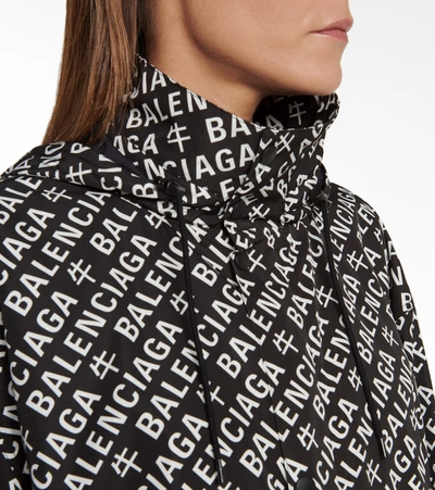 Shop Balenciaga Logo Hooded Raincoat In Black