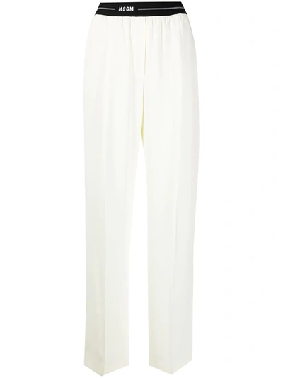 Shop Msgm Logo-waistband Trousers In White