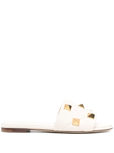 Shop Valentino Roman Stud Flat Leather Sandals In White