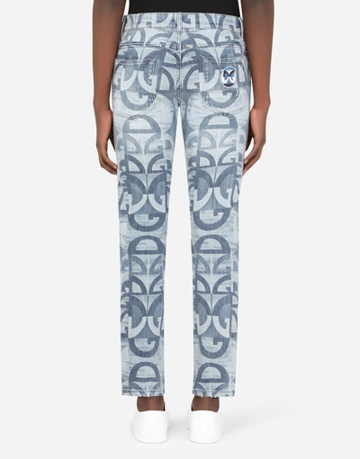 Shop Dolce & Gabbana Washed Blue Skinny Stretch Jeans With All-over Dg Logo