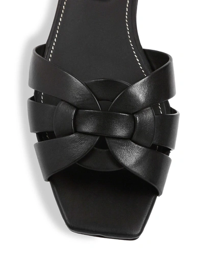 Shop Saint Laurent Women's Tribute Leather Slides In Black 1
