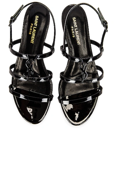 Shop Saint Laurent Cassandra Flat Sandals In Noir