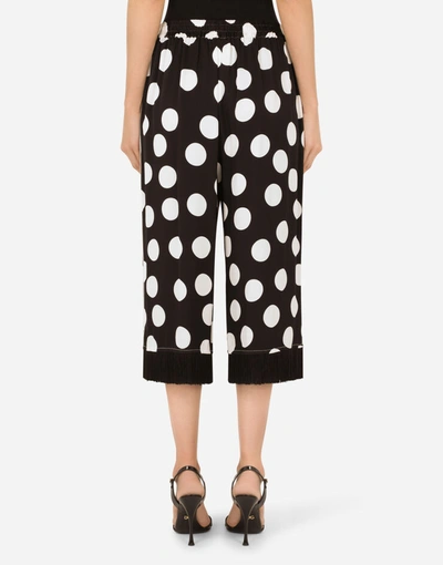 Shop Dolce & Gabbana Polka-dot Print Charmeuse Pants With Fringing