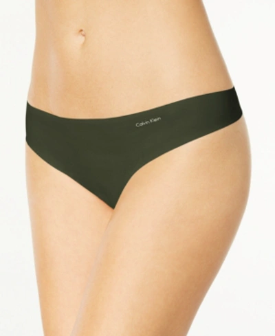 Shop Calvin Klein Women's Invisibles Thong Underwear D3428 In Duffel Bag