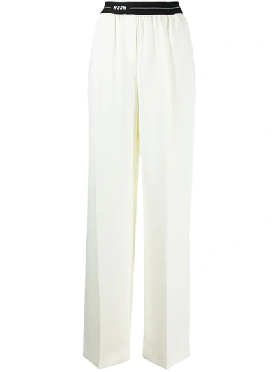 Shop Msgm Logo Waistband Palazzo Trousers In Neutrals