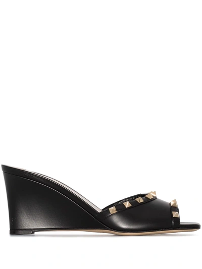 Shop Valentino Rockstud Wedge Sandals In Black